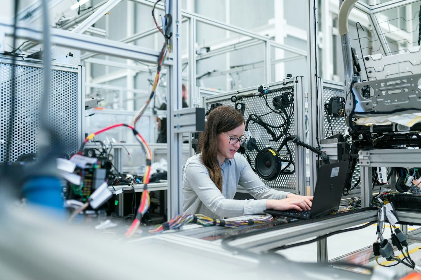 A manufacturing office with staff working on computers